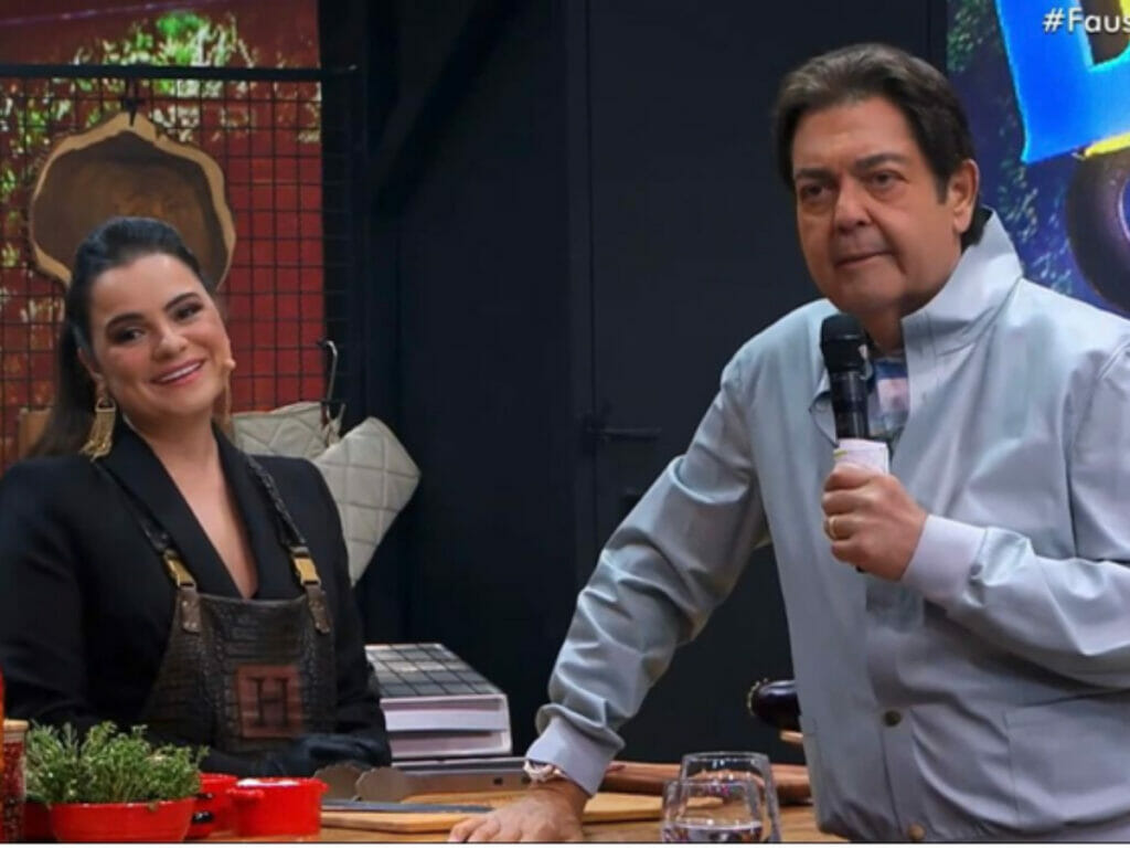 Helô Palácio, a churrasqueira do Faustão na Band, ao lado do apresentador Fausto Silva (Reprodução)